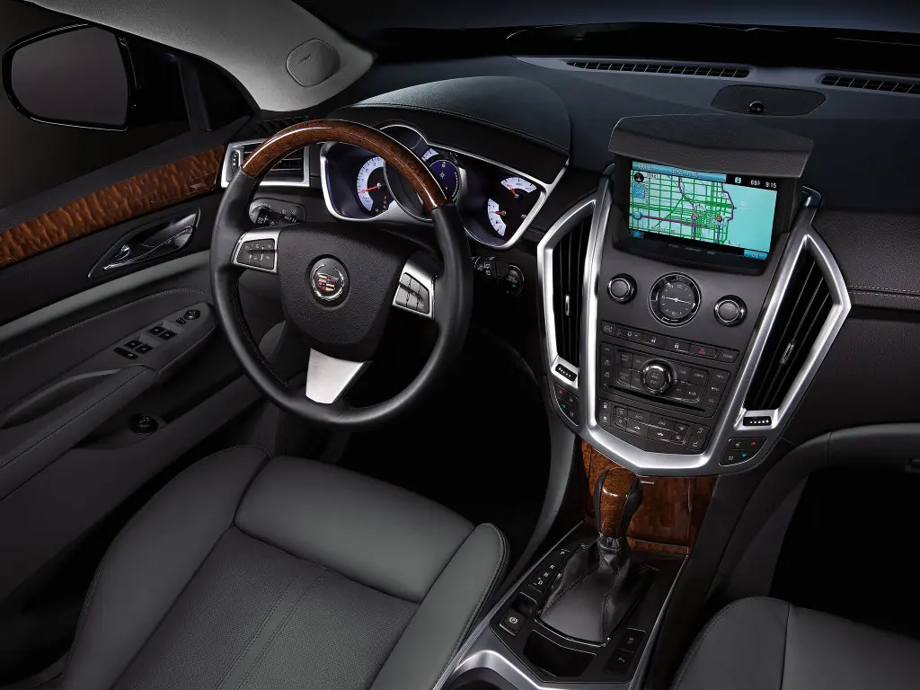 Cadillac srx: поколения, кузова по годам, история модели и года выпуска, рестайлинг, характеристики, габариты, фото - carsweek